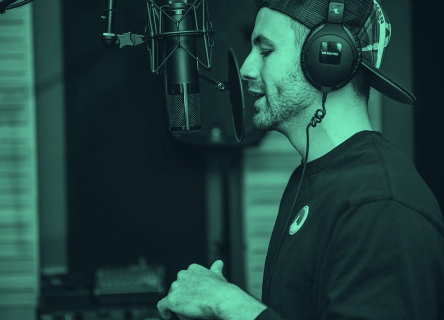 A man singing in a studio.