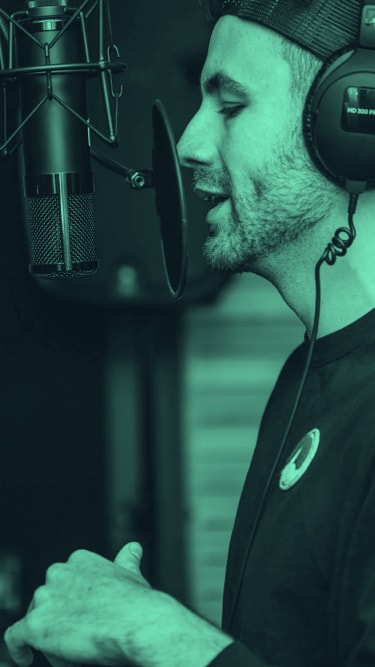 A man singing in a studio.