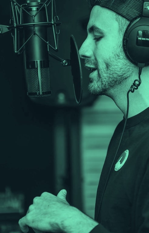 A man singing in a studio.