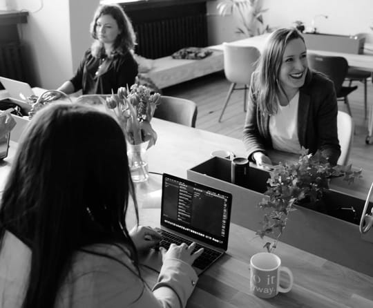 3 women in a cyber cafe environment