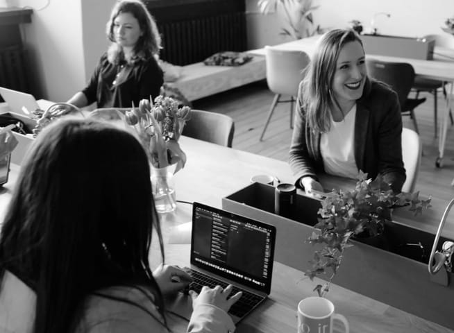 3 women in a cyber cafe environment